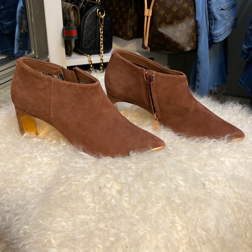 Soft suede color is a dark dusty rose.